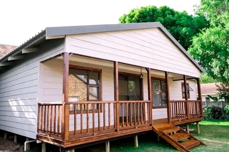 Nutec home with wooden deck and covered veranda