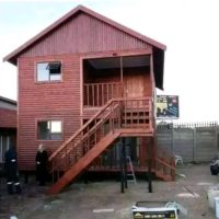Log cabin with upper deck and balcony access